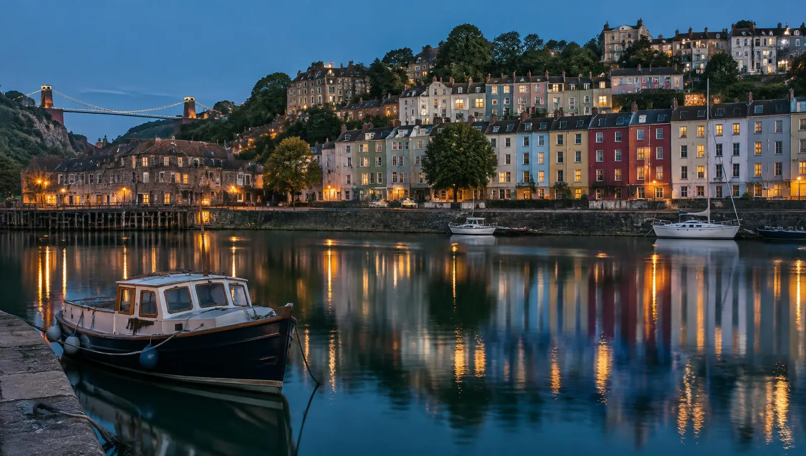 Colourful houses above Bristol Harbourside at dusk
